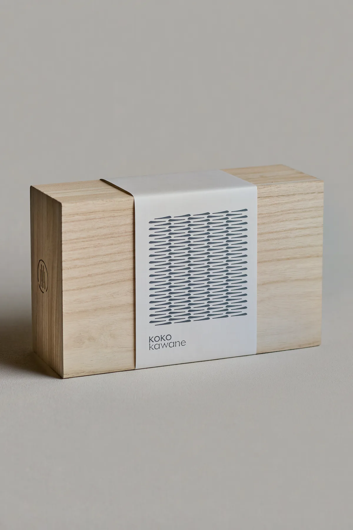 The gift box, closed, with its printed band