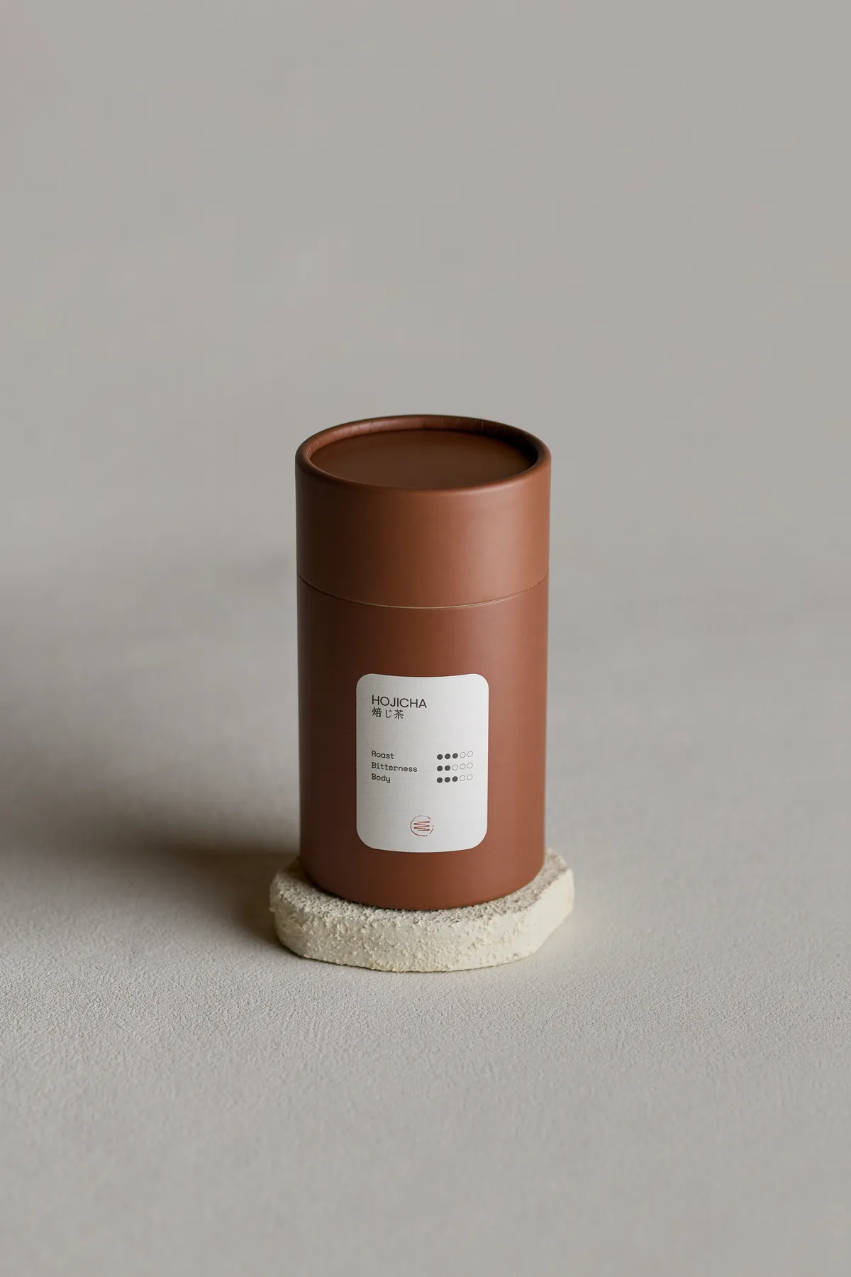 Hojicha tin on its stone